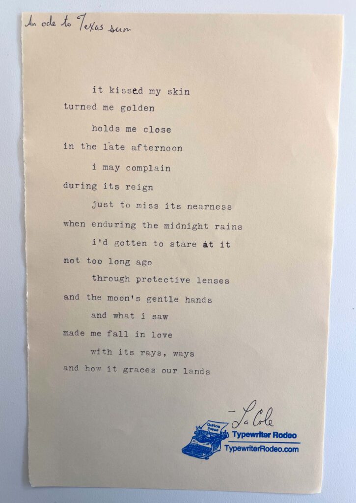 A photo of the typewritten poem on a torn half-sheet of light yellow paper.