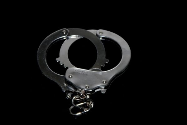 A pair of silver handcuffs