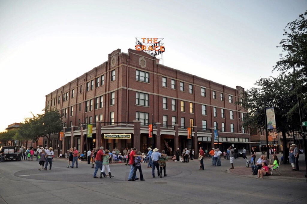 People dance at an event on the streets outside The Grace.