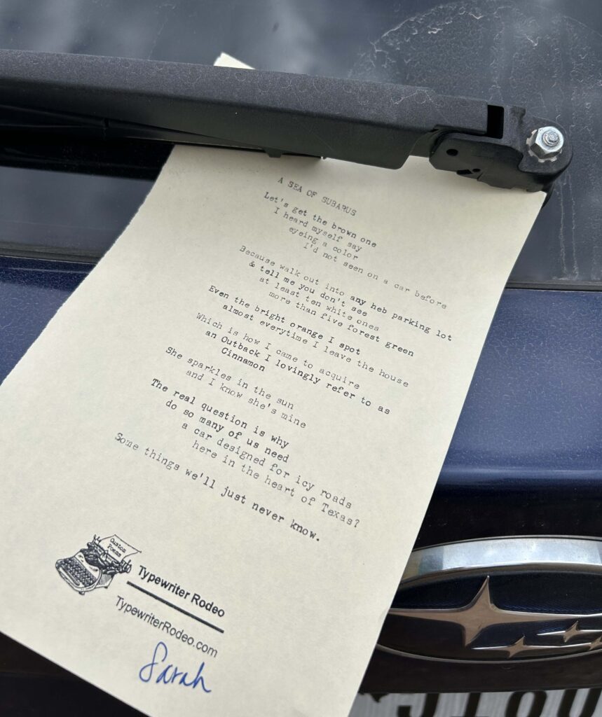 A photo of the typewritten poem on a torn half-sheet of paper.