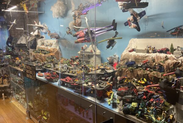 A display in the Texas Toy Museum shows dozens of vehicles, planes, boats, and action figures.