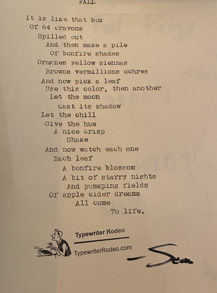 A photo of the typewritten poem on a torn half-sheet of light yellow paper.